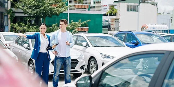 Customer being help sales person to find the right certified used vehicle